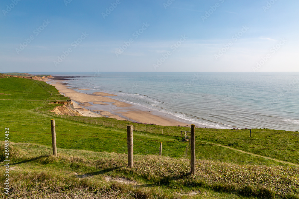 Looking out from a cliff over Compton Bay on the Isle of Wight, on a sunny day