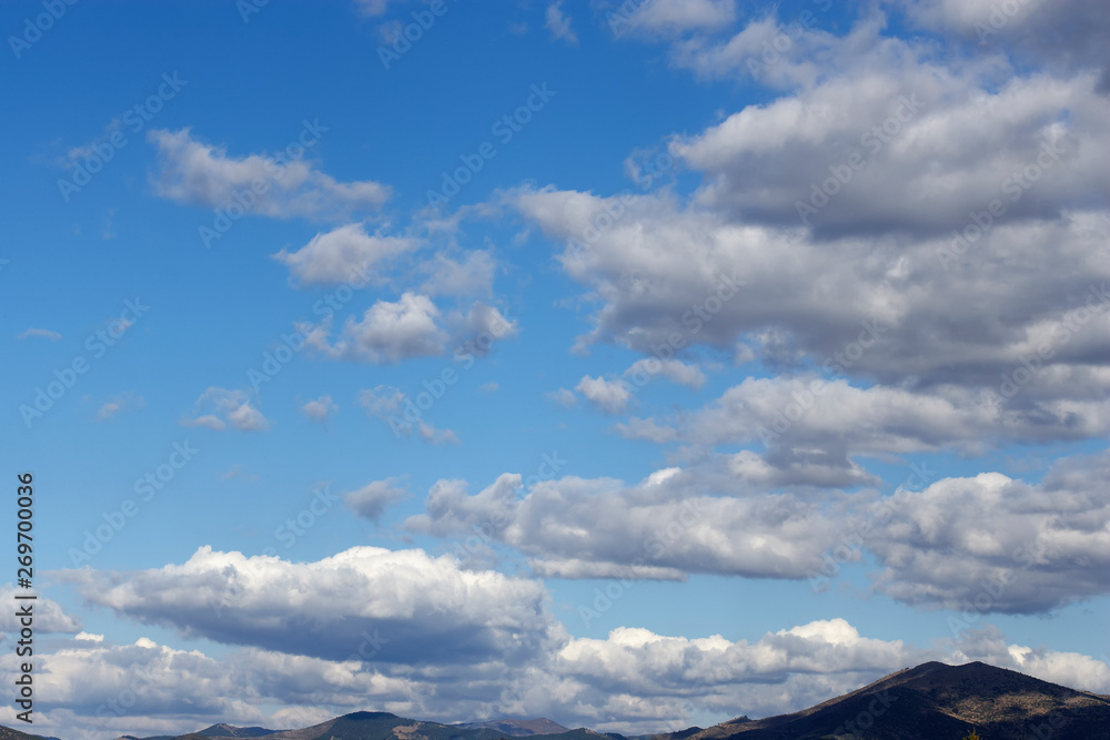 White sparse clouds over blue sky White sparse clouds over blue sky