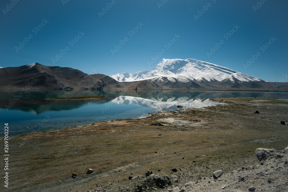 Landscape view of Karakul, Iconic mountain mirror with steady lake at Xinjiang
