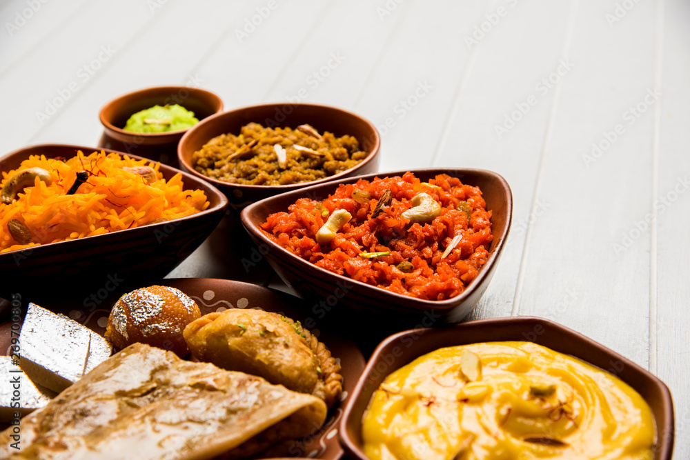 group of Indian Sweet / mithai in terracotta bowl group of Indian Sweet / mithai in terracotta bowl
