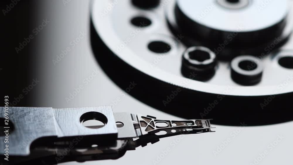 Detail of computer hard disk drive spin up and head movement. Shot in 4K UHD Detail of computer hard disk drive spin up and head movement. Shot in 4K UHD