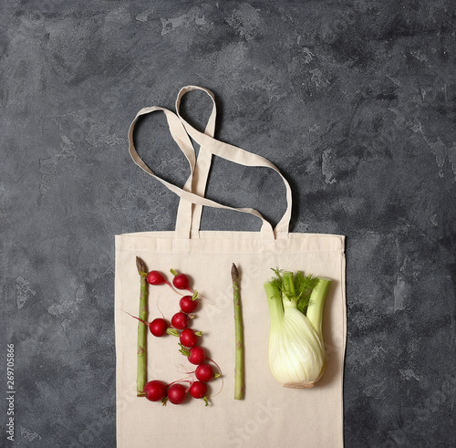 Bio and organic vegetables concept, reusable cotton bag, space for text, eco-friendly shopping, zero waste concept and lifestyle photo