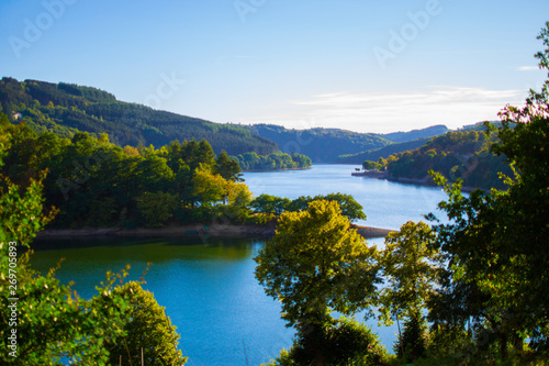 Sure river in Lultzhausen, Esch-sur-Sure, Luxembourg. Beautiful landscape with green mountains at the both sides