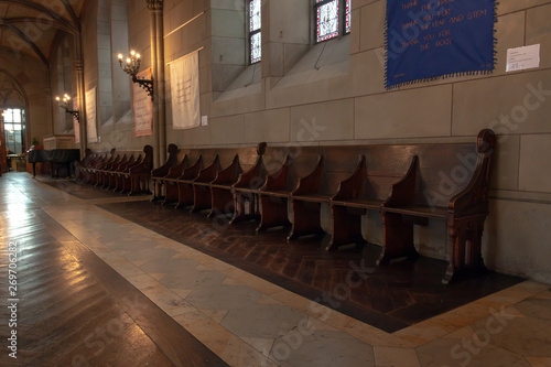 interior of church, wooden benches along the wall