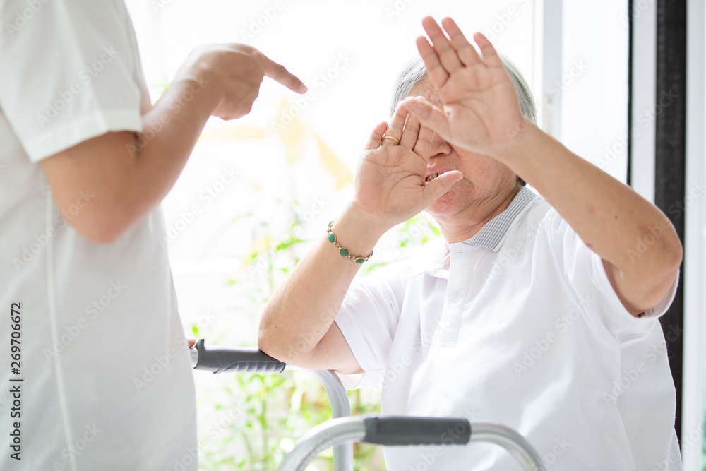 Asian elderly woman were physically abused,attacking in house,angry man  raised punishment fist,stop physical abuse senior people,caregiver,family  stop violence and aggression concept. Stock-Foto | Adobe Stock