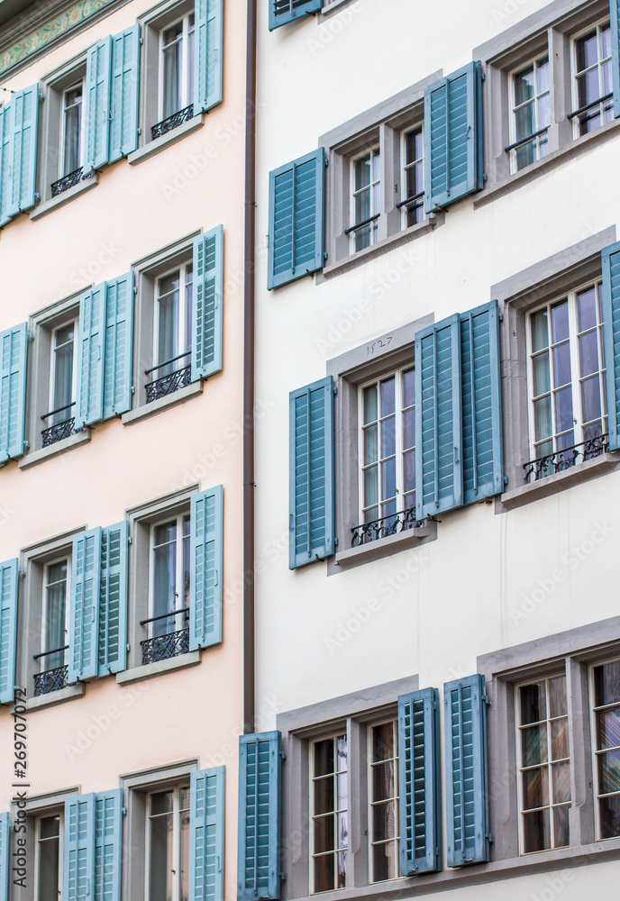 Zurich architecture. The facade of the house. Windows with shutters. Zurich Streets