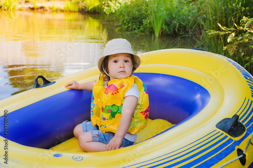 child in an inflatable boat photo