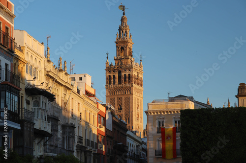 Famous tower of Giralda, Islamic architecture built by the Almohads and crowned by a Renaissance bell tower with the statue of Giraldillo at its highest point, Seville Cathedral.