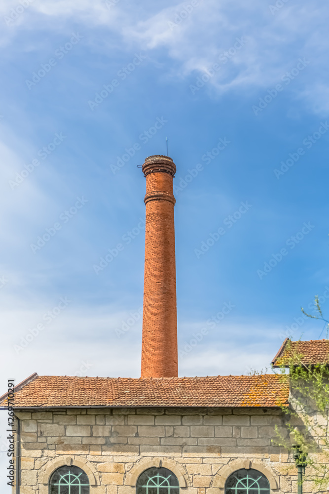 Viseu / Portugal - 04 16 2019 : View of the Museum of electricity, top building with chimney in industrial brick, Portugal