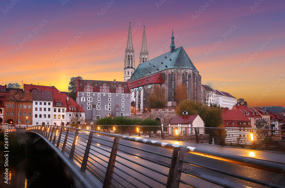 Fototapeta premium Fantastic colorful sky under sunlit during sunset, over the Church of St. Peter and Paul in Gorlitz, Germany, Wonderful picturesque scene, Amazing Colorful Cityscape. Awesome creative image. Postcard
