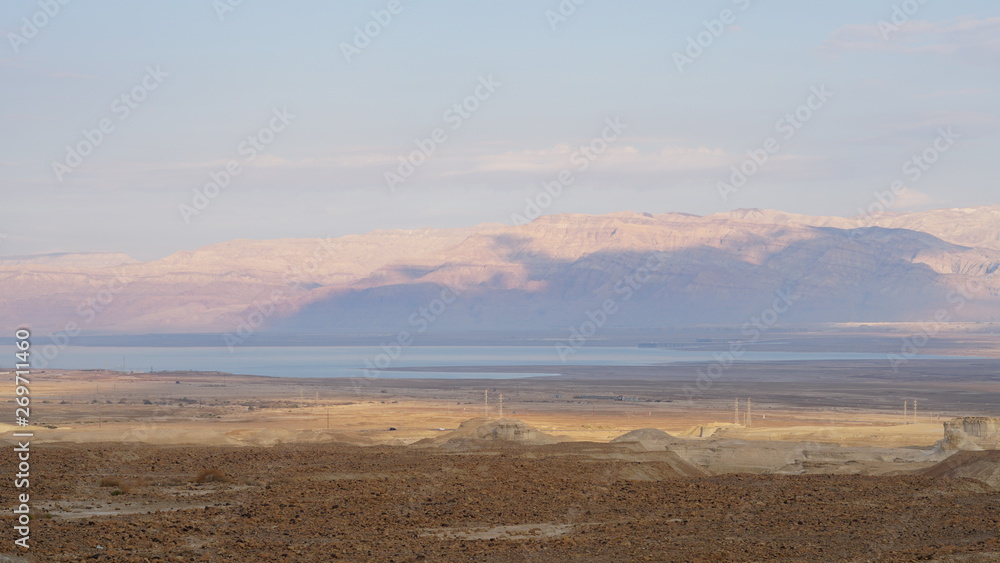 Landscape with desert and Dead Sea in Israel at sunset.