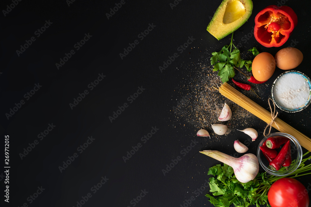 top view copy space of different fresh ingredients for cooking on the black tables - obrazy, fototapety, plakaty 