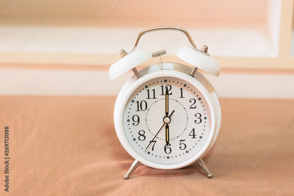 Alarm clock on the bed, Wakes up in the morning , Vintage Alarm clock on the bed, Wakes up in the morning , Vintage