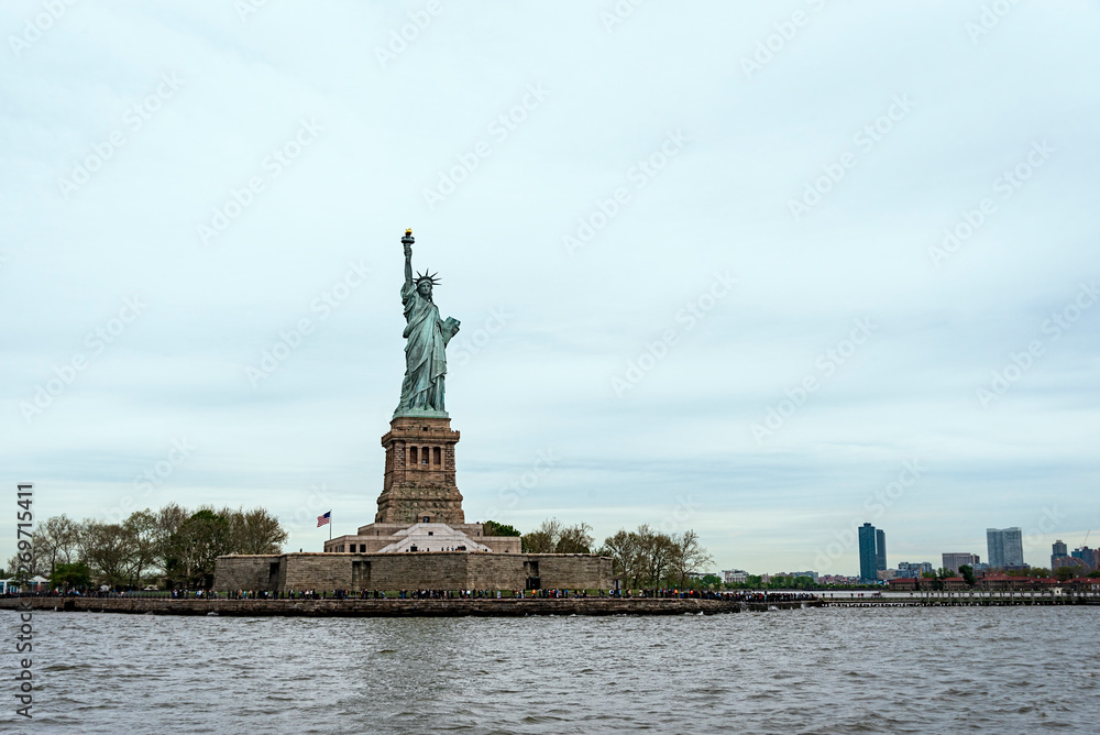 USA, New York - May 2019: Statue of Liberty, Liberty Island, with Manhtattan in the background USA, New York - May 2019: Statue of Liberty, Liberty Island, with Manhtattan in the background