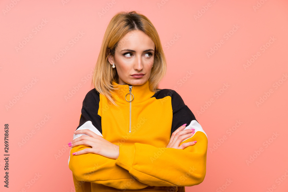 Young blonde woman over isolated pink background portrait Young blonde woman over isolated pink background portrait