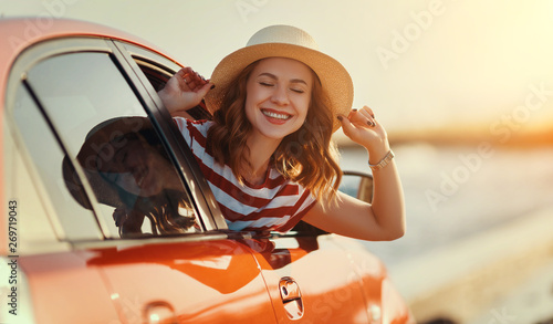 happy woman girl goes to summer travel trip in car.