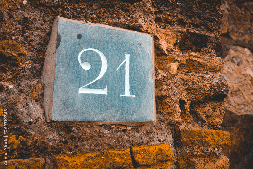 stone sign of ancient building with number 21 stone sign of ancient building with number 21