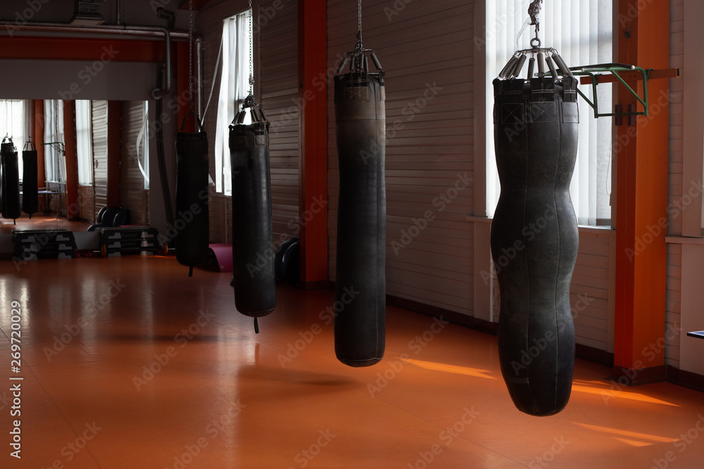 gym with four punching bags of various types