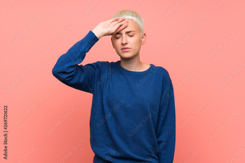 Teenager girl with white short hair over pink wall with tired and sick expression Teenager girl with white short hair over pink wall with tired and sick expression