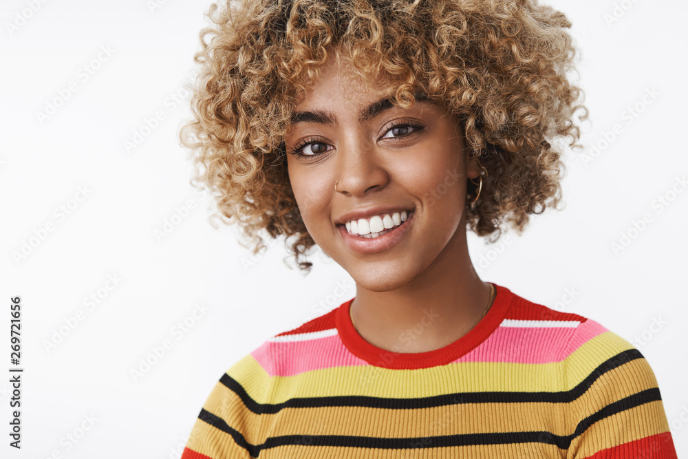Joyful carefree and delighted cute african-american female student smiling broadly looking at camera fulfilled and accomplished feeling awesome as receiving scholarship abroad over white wall Joyful carefree and delighted cute african-american female student smiling broadly looking at camera fulfilled and accomplished feeling awesome as receiving scholarship abroad over white wall