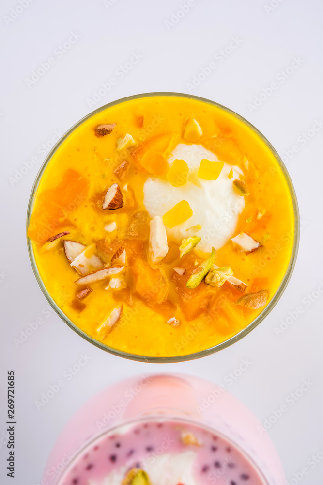 Falooda / Faluda is a popular Indian dessert - Strawberry and Mango flavoured which has Ice cream, noodles, sweet basil seeds and nuts, selective focus Falooda / Faluda is a popular Indian dessert - Strawberry and Mango flavoured which has Ice cream, noodles, sweet basil seeds and nuts, selective focus
