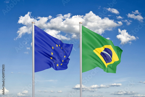 European Union vs Brazil. Thick colored silky flags of European Union and Brazil. 3D illustration on sky background. - Illustration