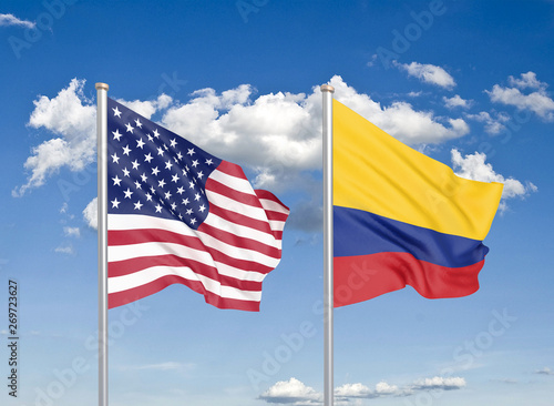 United States of America vs Colombia. Thick colored silky flags of America and Colombia. 3D illustration on sky background. - Illustration