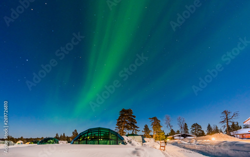 Northern lignt in Finland over Igloo house  photo