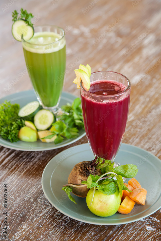 Fresh organic smoothies in the glasses with ingredients around Fresh organic smoothies in the glasses with ingredients around