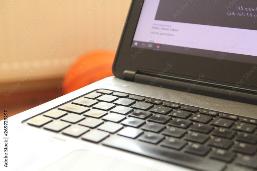 typing on a laptop computer keyboard close up typing on a laptop computer keyboard close up