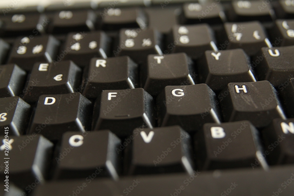 typing on a laptop computer keyboard close up typing on a laptop computer keyboard close up