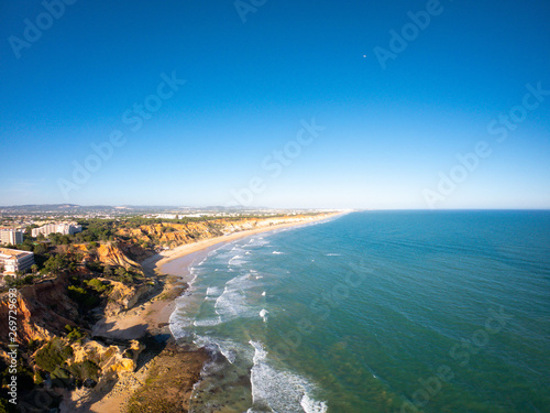 Algarve, Portugal aerial view on beach and coast of Atlantic Ocean. Hotels zone on Cliffs in Praia de Falesia Albufeira 