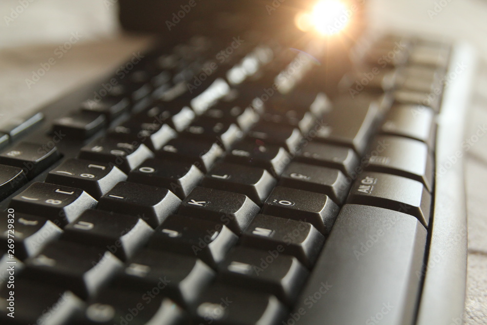 typing on a laptop computer keyboard close up