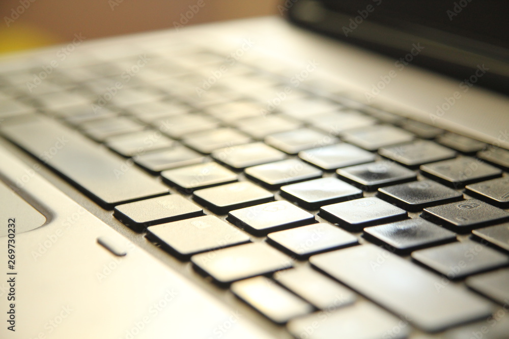 typing on a laptop computer keyboard close up typing on a laptop computer keyboard close up