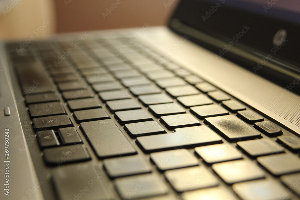 typing on a laptop computer keyboard close up typing on a laptop computer keyboard close up