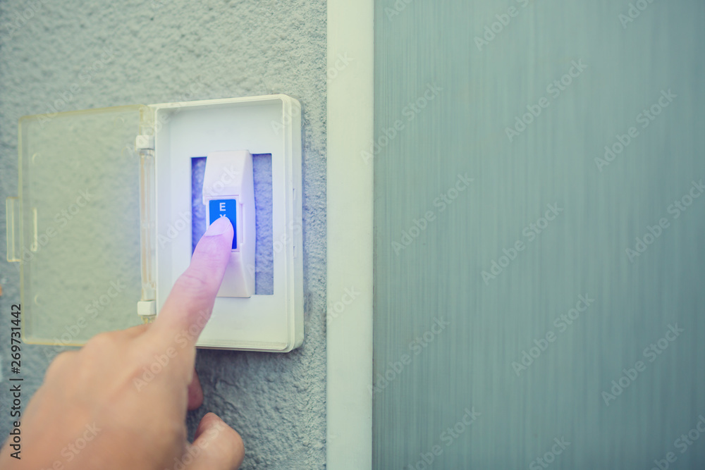 man push the white exit button on electronic panel. staff push exit button to open door man push the white exit button on electronic panel. staff push exit button to open door