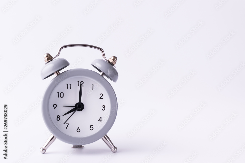 clock with alarm clock stand on a white background and show the exact time with arrows clock with alarm clock stand on a white background and show the exact time with arrows