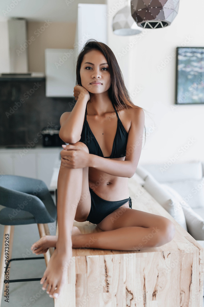 Young asian model in bikini swimsuit posing in her house Stock Photo |  Adobe Stock