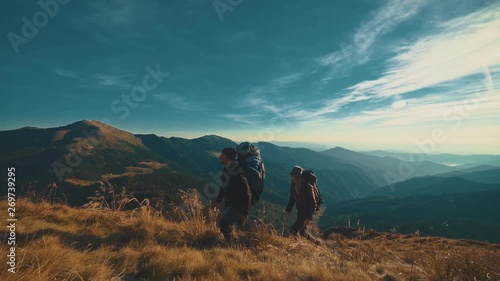 The couple walking to the mountain. slow motion