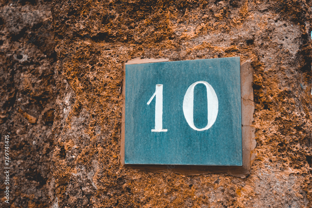 number 10 sign on grey marble stone number 10 sign on grey marble stone
