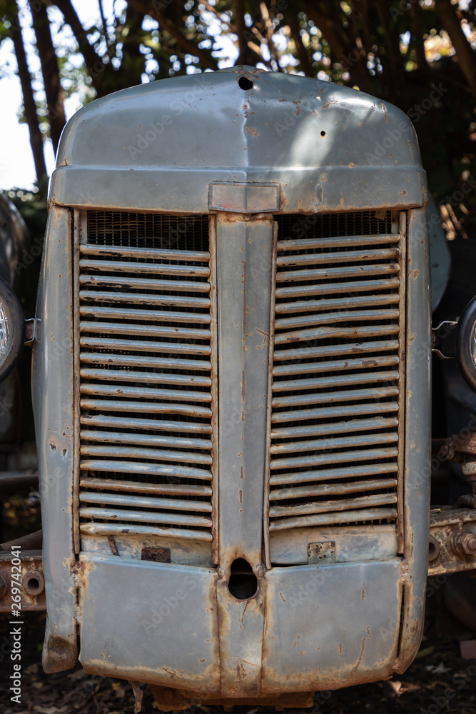 Detail of the front grill of an old, abandoned tractor Detail of the front grill of an old, abandoned tractor