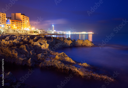 Night view of St. Julian's from Fond Ghadir Beach, Malta photo