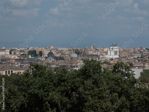 Rome cityscape with the Altar of the Fatherland (also known as Vittoriano or Vittorio Emanuele II Monument) on background