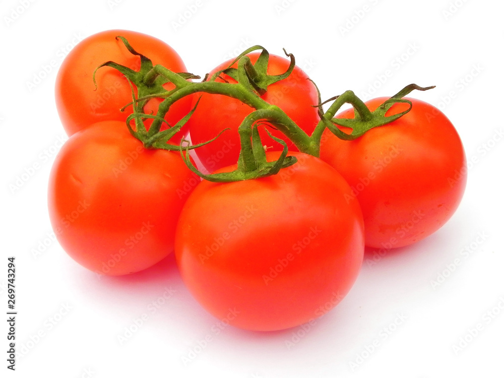 Red ripe tomatoes on the green branch. Red ripe tomatoes on the green branch.