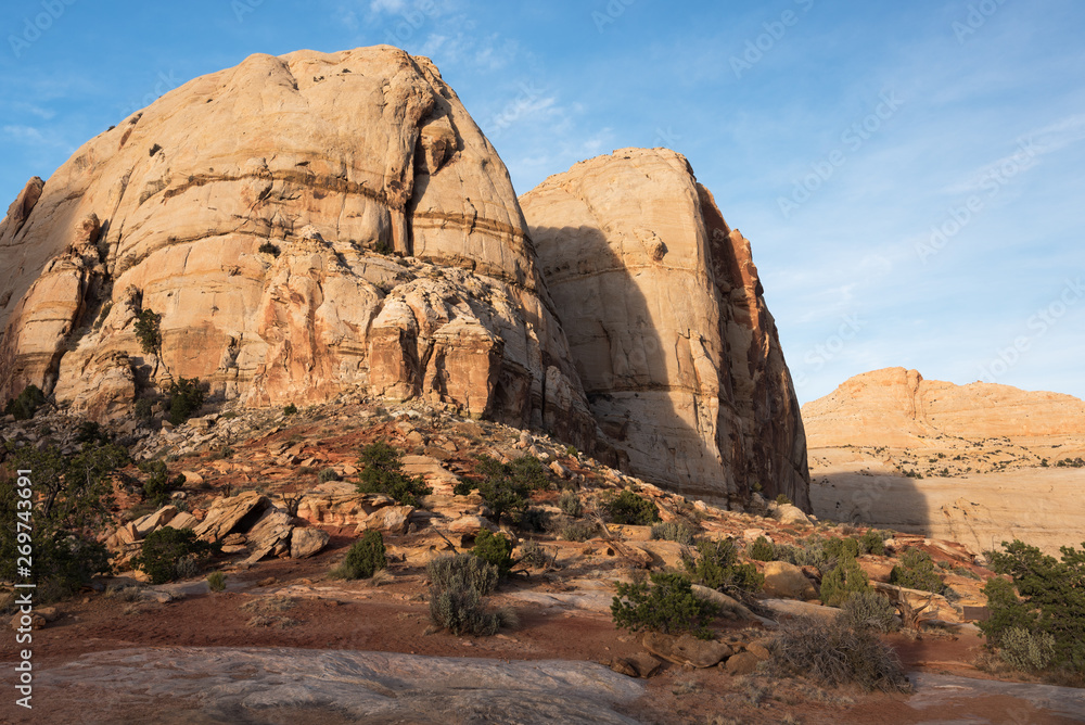 Fototapeta premium Monolithic rock formations are found throughout Capital Reef National Park, Utah. Navajo Dome can be seen on the trail to Hickman Arch.