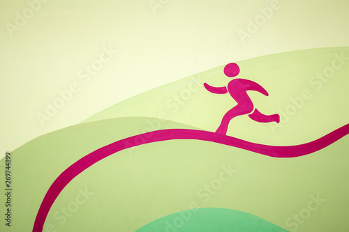 The image of a running man of pink color running along a curved line on a yellow-green background