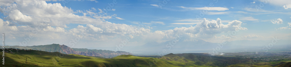 Fototapeta premium Landscape with mountains on background and cloudy sky, panorama