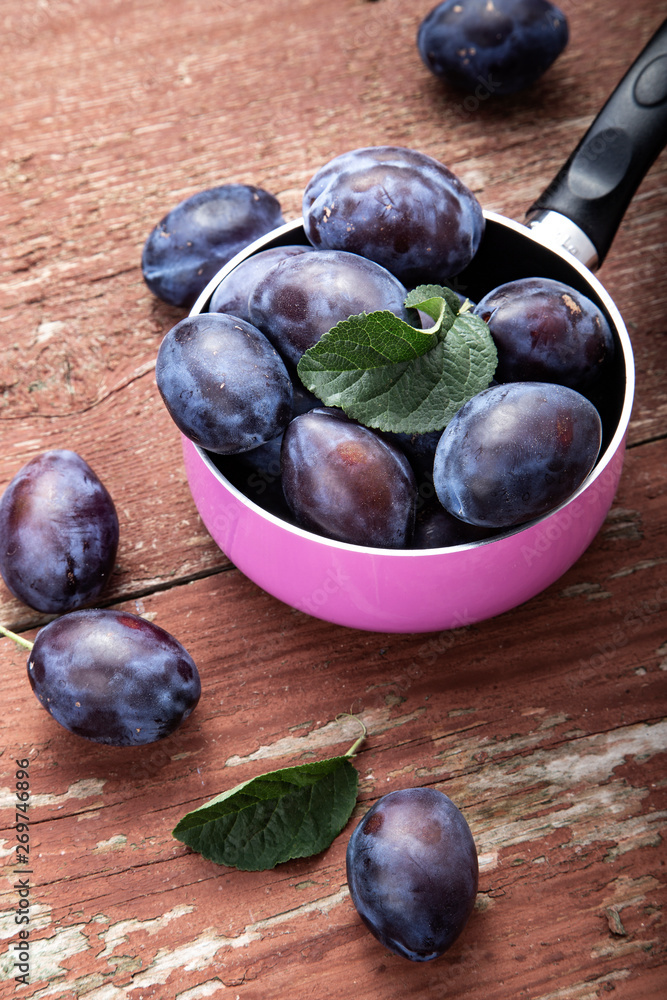 plums on the table on a shabby background plums on the table on a shabby background