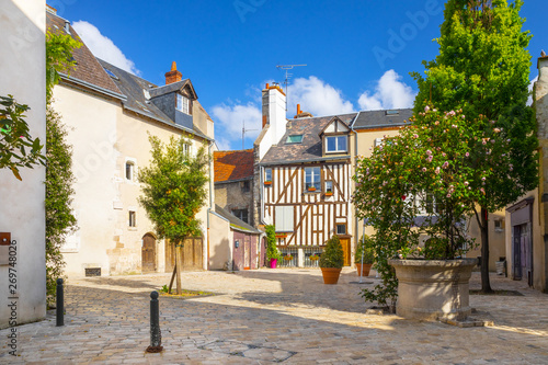 Street, paved with stone blocks and half-timbered house in the center of Orleans, France photo