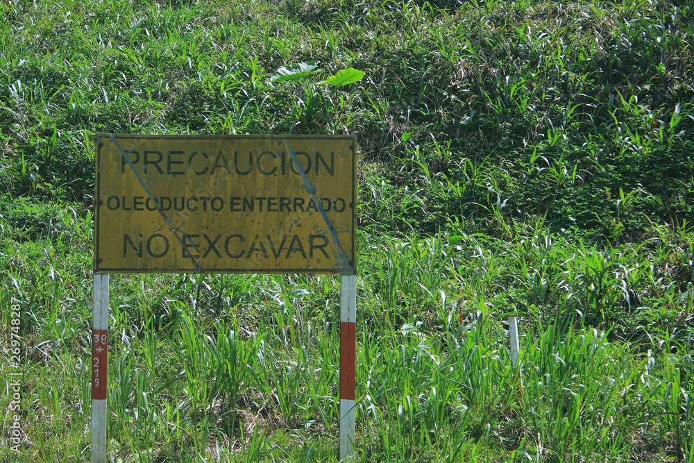 Puyo, Ecuador, 24-5-2019: sign warning not to dig because of the oil pipe present here